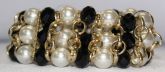 PULSEIRA ELOS COM PÉROLAS E PEDRAS PRETAS dour