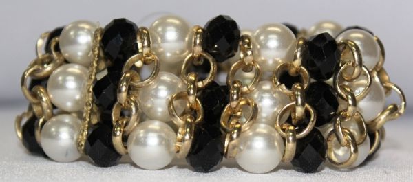 PULSEIRA ELOS COM PÉROLAS E PEDRAS PRETAS dour
